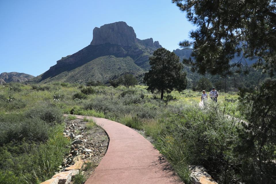 Visitors walk through the Chisos Basin of Big Bend National Park on Oct. 16, 2016.