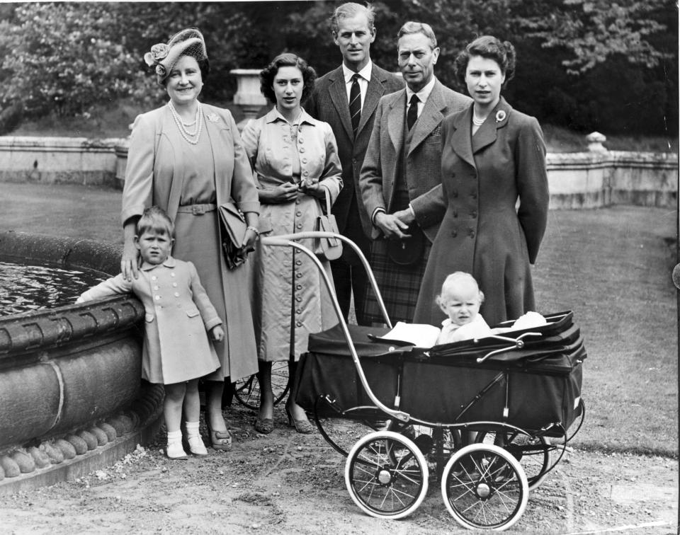 22nd August 1951:  The Royal Family during a visit to Balmoral Castle: (left to right) Queen Elizabeth, Princess Margaret Rose (1930 - 2002), Prince Philip, Duke of Edinburgh, King George VI (1895 - 1952), and Princess Elizabeth with her children Prince Charles (left) and Princess Anne. Queen Victoria's husband, Prince Albert, purchased Balmoral Castle in 1846, and the small castle which stood in the 7,000 hectare wooded estate was redeveloped in the 1850s.The granite building was designed by Aberdeen architect William Smith with suggestions from Albert himself, who decided the interior decoration should represent a Highland shooting box with tartan or thistle chintzes, and walls decorated with trophies and weapons. Queen Victoria often visited the Highlands with her family, especially after Albertfs death in 1861, and Balmoral is still a popular retreat for the present royal family.  (Photo by Fox Photos/Getty Images)
