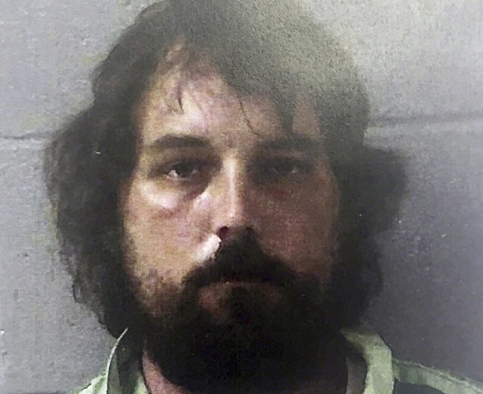 FILE - This Feb. 22, 2017, file photo provided by the Georgia Bureau of Investigation shows Ryan Duke. Georgia's highest court opened a door Monday, March 15, 2021, for taxpayer funds to help cover the legal defense of Duke, who is awaiting trial for the 2005 slaying of a high school teacher whose disappearance remained a mystery for more than a decade. (Georgia Bureau of Investigation via AP, File)