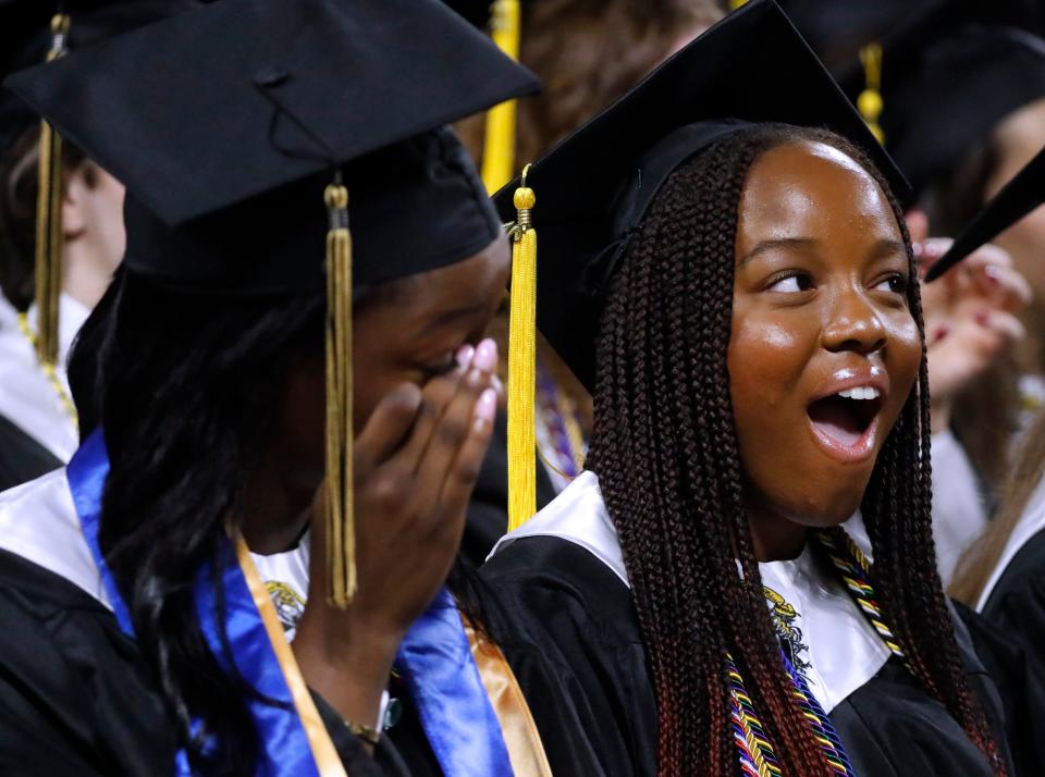 Central Magnet School graduates Noella Obi, left and Mesom Okafor, right react to Central Magnet School’s faculty and staff reflections during the Central Magnet School graduation at MTSU’s Murphy Center on Monday, May 13, 2024.