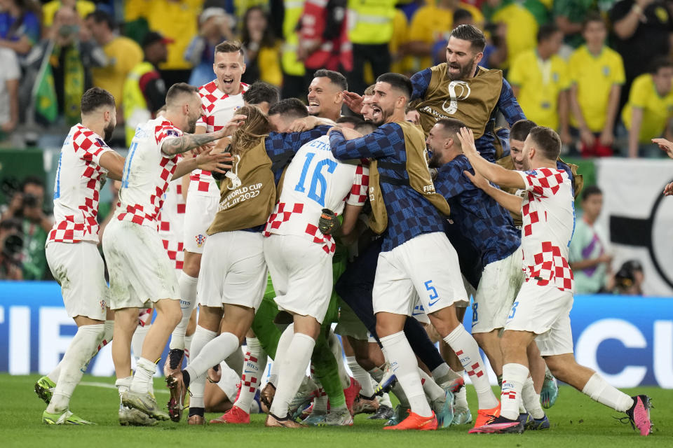 Croatia team celebrate after the World Cup quarterfinal soccer match between Croatia and Brazil, at the Education City Stadium in Al Rayyan, Qatar, Friday, Dec. 9, 2022. (AP Photo/Andre Penner)