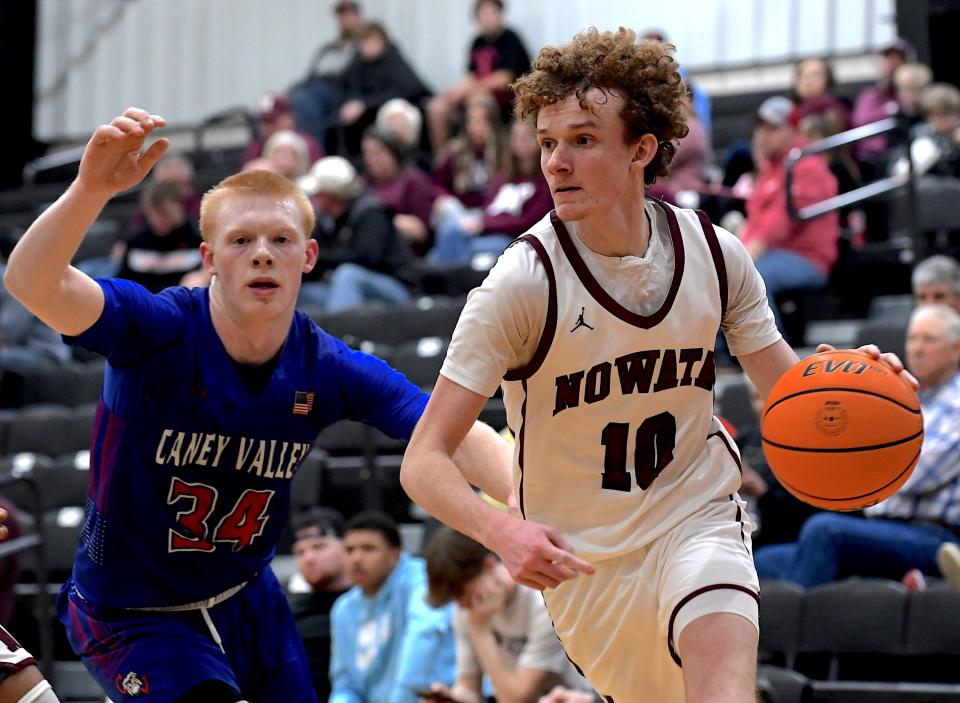 Nowata High School's Ryan Walton (10) drives the ball against Caney Valley KS in basketball action in Nowata on Dec. 2, 2024. The Nowata Ironmen defeated the Bullpups 70-53.