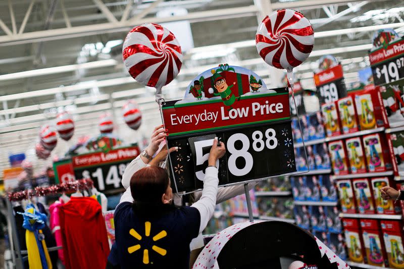 FILE PHOTO: A Walmart worker organises products for Christmas season at a Walmart store in Teterboro