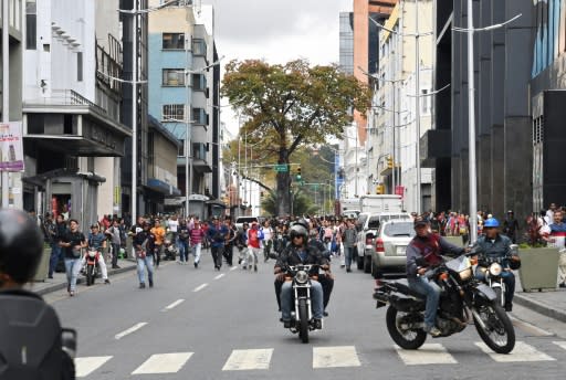 Armed pro-government civilians known as "colectivos" - like these that allegedly fired on opposition lawmakers - have an infamous reputation in Venezuela