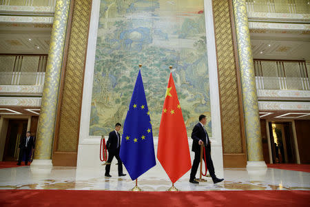 Staff members prepare for the EU-China High-level Economic Dialogue at Diaoyutai State Guesthouse in Beijing, China, June 25, 2018. REUTERS/Jason Lee