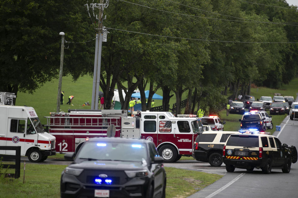 Emergency personnel respond to the scene of a deadly crash on Tuesday, May 14, 2024 near Dunnellon, Fla. The Florida Highway Patrol says a bus carrying farmworkers in central Florida has overturned, killing several people and injuring other passengers. (AP Photo/Alan Youngblood)