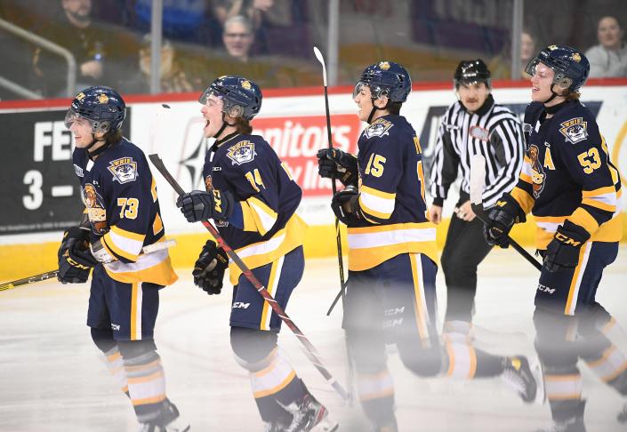 Erie Otters players, from left: Connor Lockhart, Noah Sedore, Christian Kyrou and Cameron Morton celebrate the first goal of the game on Thursday against the Flint Firebirds at the Erie Insurance Arena. Lockhart scored at :33 in the first period with assists from Sedore and Kyrou, but the Otters lost to the Firebirds, 6-3.