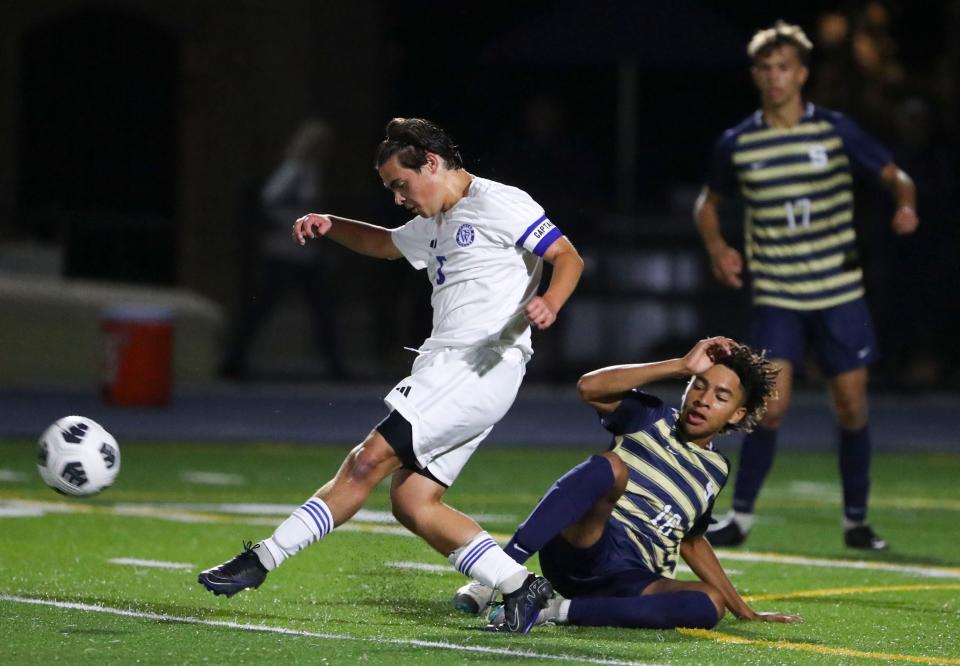 Charter School of Wilmington's Nicholas Livaditis (left) clears the ball from Salesianum's Aiden Gonzalez in the first half of Salesianum's 2-0 win at Abessinio Stadium, Tuesday, Sept. 19, 2023.