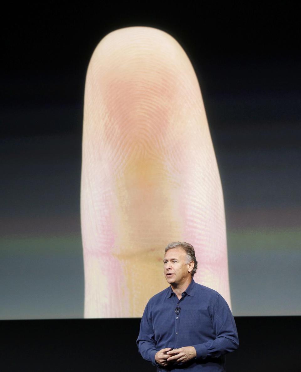 Phil Schiller, senior vice president of worldwide marketing for Apple Inc, talks about the new iPhone 5S Touch ID fingerprint recognition feature at Apple Inc's media event in Cupertino