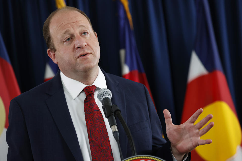 Colorado Governor Jared Polis makes a point during a news conference on the state's efforts against the new coronavirus Tuesday, July 21, 2020, in Denver. (AP Photo/David Zalubowski)