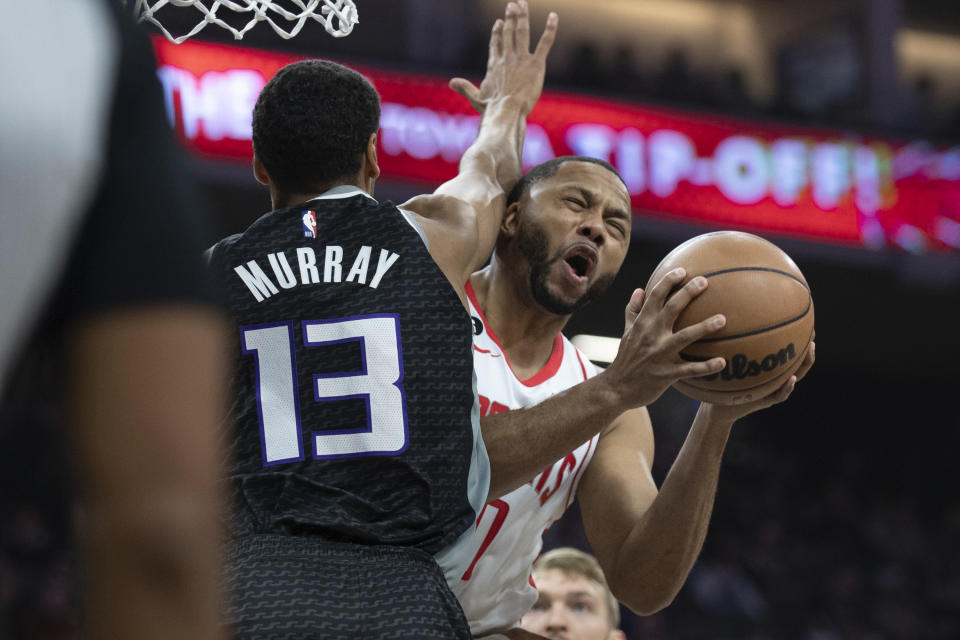 Houston Rockets guard Eric Gordon is fouled by Sacramento Kings forward Keegan Murray (13) during the first half of an NBA basketball game in Sacramento, Calif., Wednesday, Jan. 11, 2023. (AP Photo/José Luis Villegas)