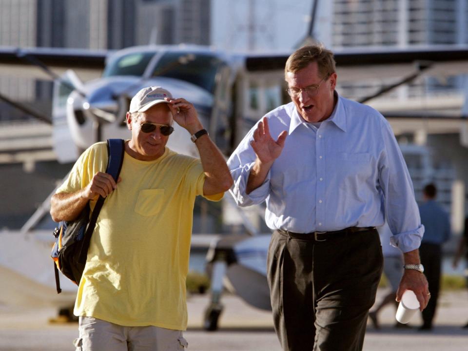 Gubernatorial Democratic candidate for Florida Bill McBride (R) and Jimmy Buffett walk together after the singer endorsed him as his choice to be the next governor October 23, 2002 in Miami, Florida.