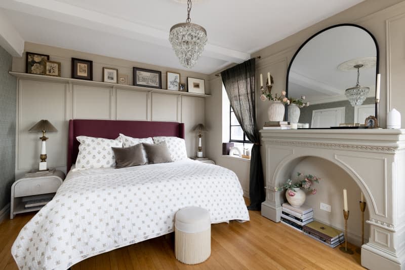 Floral patterned bedding on upholstered bedframe in neutral bedroom