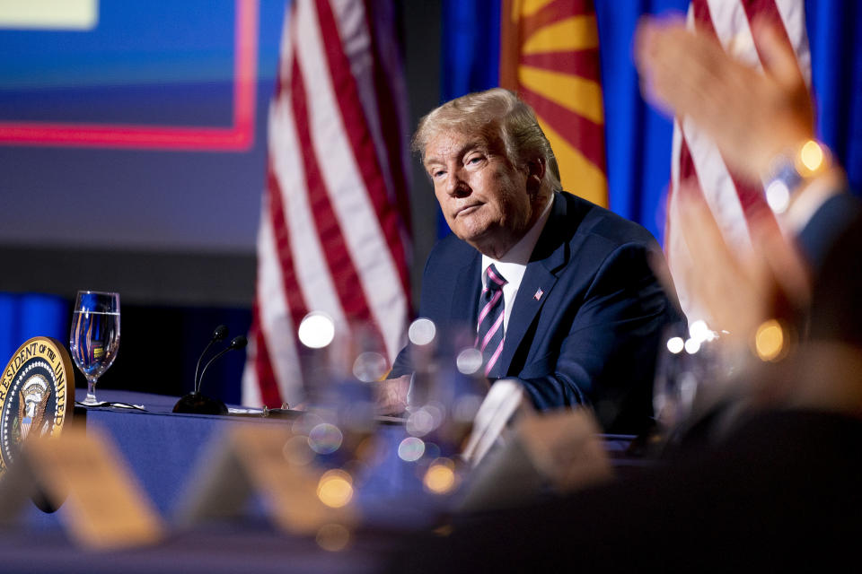 President Donald Trump listens during a Latinos for Trump Coalition roundtable campaign event at Arizona Grand Resort & Spa, Monday, Sept. 14, 2020, in Phoenix. (AP Photo/Andrew Harnik)