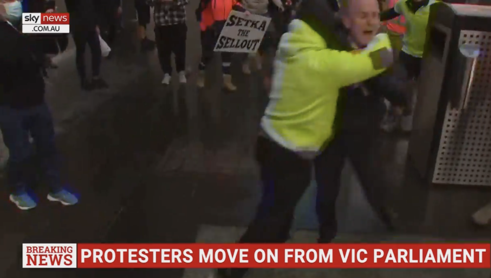 Dowsley was filmed being pushed into a bin by a protester. (skynews.com.au)