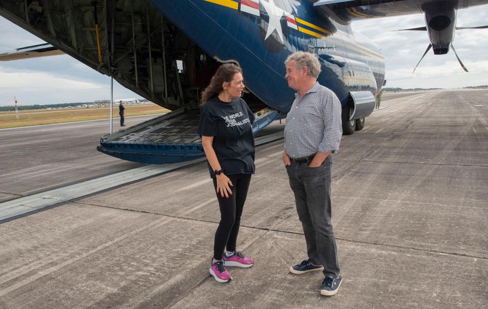 Pensacola News Journal Executive Editor Lisa Nellessen Savage and Innisfree Inc. CEO and Founder Julian MacQueen get a close-up look at U.S. Marine Corps C-130j Hercules as the pair waits for a ride on "Fat Albert" on Thursday, November 10, 2022.