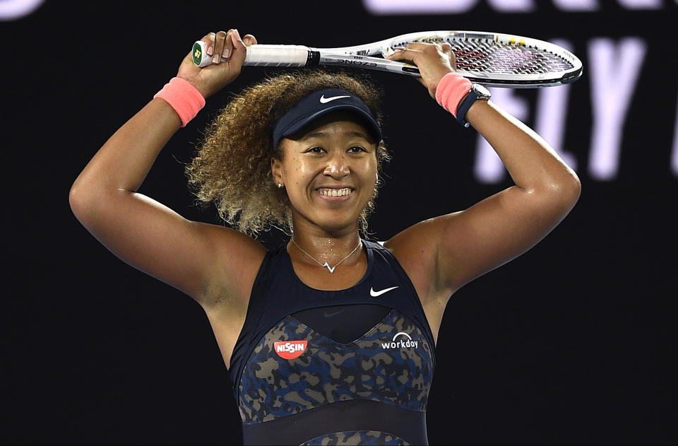 Japan's Naomi Osaka celebrates after defeating United States' Jennifer Brady during the women's singles final at the Australian Open tennis championship in Melbourne, Australia, Saturday, Feb. 20, 2021..(AP Photo/Andy Brownbill)