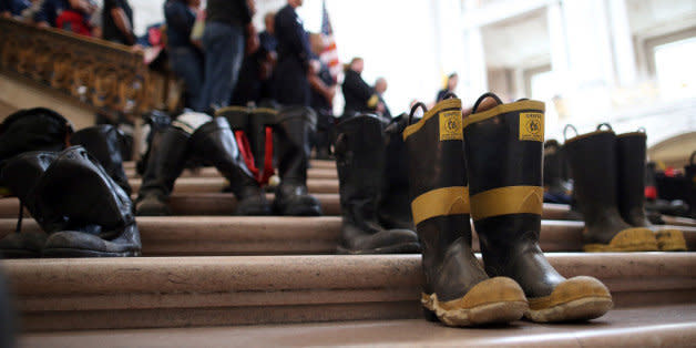 SAN FRANCISCO, CA - MARCH 26:  Firefighter boots line the stairs inside San Francisco City Hall during a remembrance ceremony held for San Francisco firefighters who have died of cancer on March 26, 2014 in San Francisco, California. Over two hundred pairs of boots were displayed on the steps inside San Francisco City Hall to symbolize the 230 San Francisco firefighters who have died of cancer over the past decade. According to a study published by the National Institute for Occupational Safety and Health, (NIOSH)  findings indicate a direct correlation between exposure to carcinogens like flame retardants and higher rate of cancer among firefighters.   The study showed elevated rates of respiratory, digestive and urinary systems cancer and also revealed that participants in the study had high risk of mesothelioma, a cancer associated with asbestos exposure.  (Photo by Justin Sullivan/Getty Images) (Photo: )