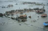 Damaged neighborhoods surrounded by water are seen from a U.S. Air Force helicopter conducting search and rescue operations after Hurricane Ike struck Galveston, Texas, in this September 13, 2008 file handout photograph. REUTERS/U.S. Air Force Staff Sgt. James L. Harper Jr./Handout via Reuters