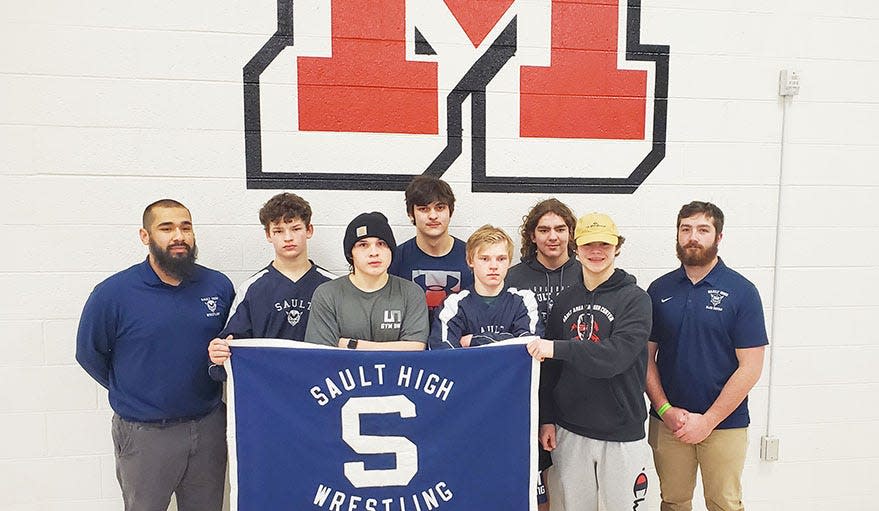 Sault HIgh wresters are pictured at the UP Championship tournament in Marquette. The Sault team includes, front row, from left to right: Tommy Vassar, Will Ohman, Owen Clayton, and assistant coach Brendin Cryderman; back row, from left: head coach Cinto Arreola, Cody Russo, Robert Allard, Sawyer Kuenzer. 
Missing from photo:: Chase Tracey and Calvin Aldrich.