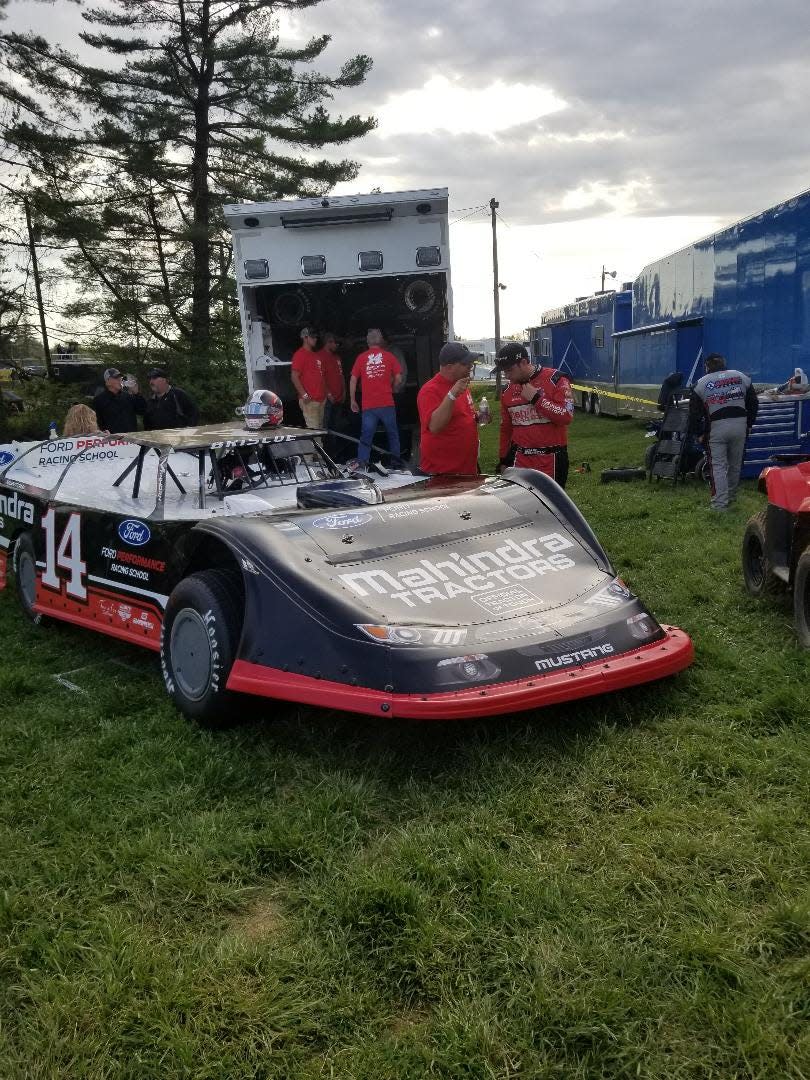 Mitchell's Chase Briscoe (right) gets advice from a crew member prior to his Late Model qualifying run Wednesday night at Brownstown Speedway.