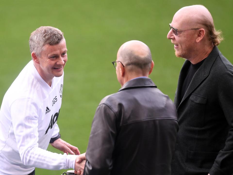 Ole Gunnar Solskjaer with brothers Joel and Avram Glazer (Getty Images)