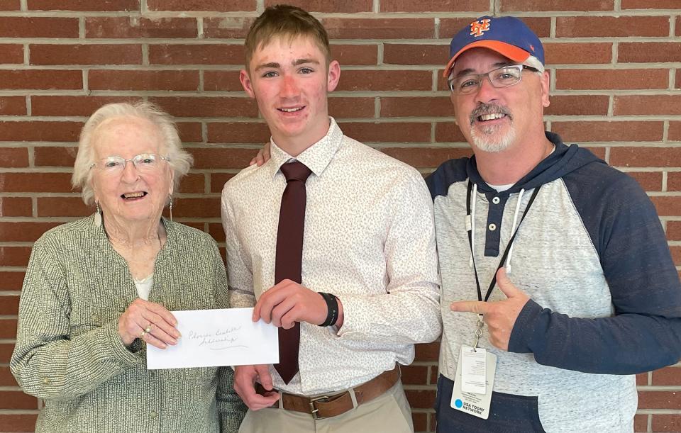 Honesdale senior shortstop Nate Hugaboom is the first recipient of the David S. Edwards Memorial Scholarship. Pictured here presenting the award to Nate (center) are Barbara Baxter Edwards (left) and Kevin Edwards (right).