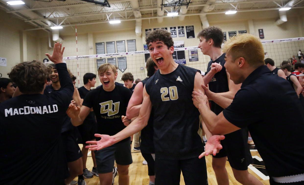 Jerome's Kai Van Bourgondien and the rest of the Celtics celebrate after defeating Thomas Worthington 25-19, 25-23, 19-25, 13-25, 19-17 in a Division I, East Region final May 28 at Westerville Central.