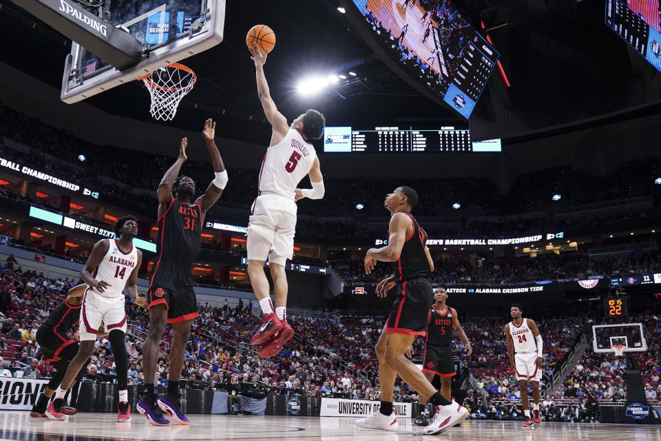 Alabama guard Jahvon Quinerly (5) shoots the ball against San Diego State forward Nathan Mensah (31) in the first half of a Sweet 16 round college basketball game in the South Regional of the NCAA Tournament, Friday, March 24, 2023, in Louisville, Ky. (AP Photo/John Bazemore)