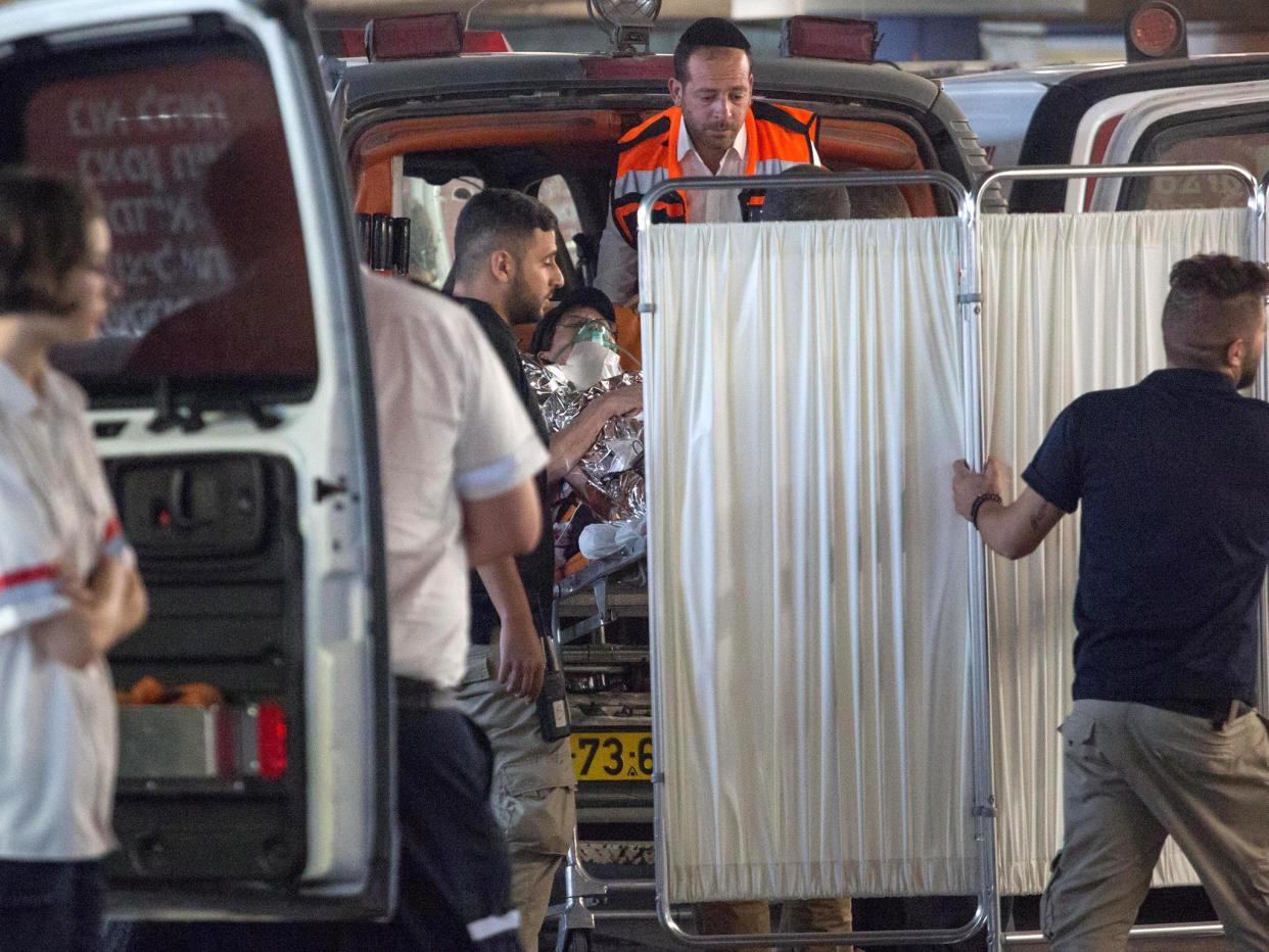 Medics evacuate an Israeli woman who was injured during a knife attack: REUTERS