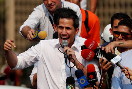 Venezuelan opposition leader Juan Guaido, who many nations have recognized as the country's rightful interim ruler, speaks during a protest against Venezuelan President Nicolas Maduro's government in Caracas, Venezuela, April 10, 2019. REUTERS/Carlos Garcia Rawlins