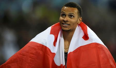 2016 Rio Olympics - Athletics - Final - Men's 200m Final - Olympic Stadium - Rio de Janeiro, Brazil - 18/08/2016. Second placed Andre De Grasse (CAN) of Canada celebrates. REUTERS/Dylan Martinez