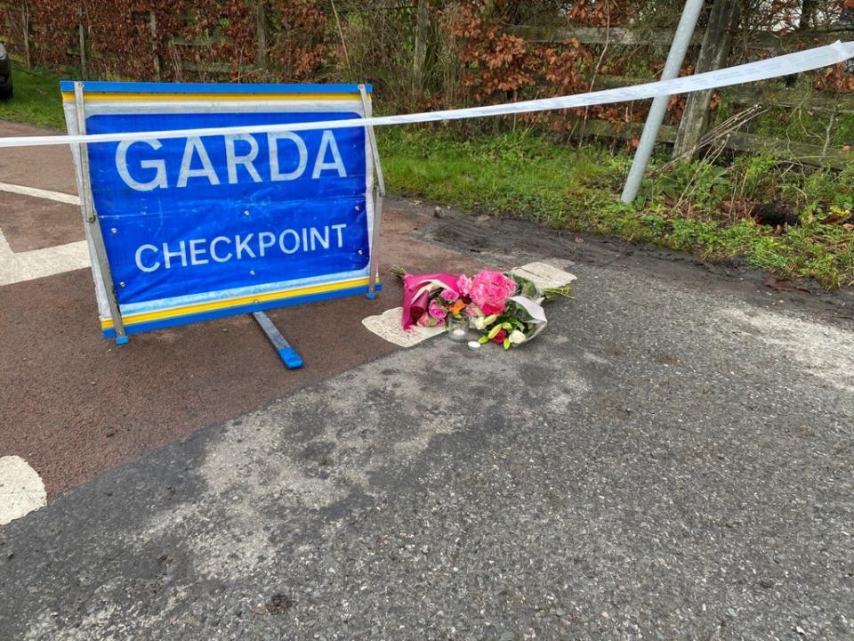 Flowers were left at a Garda checkpoint after the primary school teacher’s death (Dominic McGrath/PA) (PA Wire)