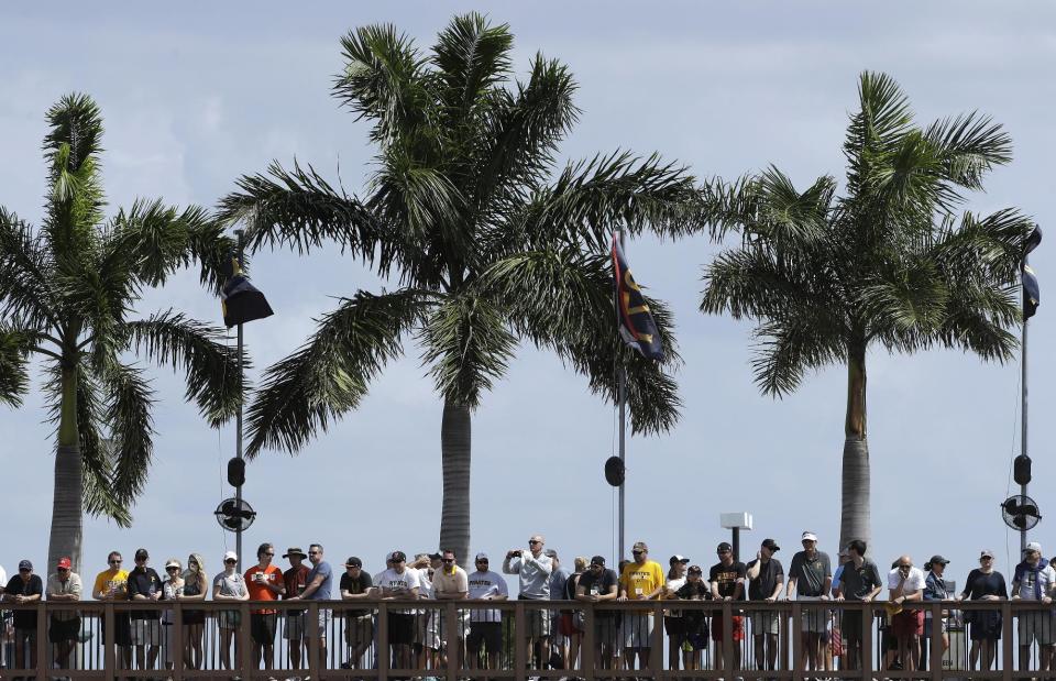 Fans watch from a boardwalk during the first inning of a spring training baseball game between the Pittsburgh Pirates and the New York Yankees Monday, March 6, 2017, in Bradenton, Fla. (AP Photo/Chris O'Meara)