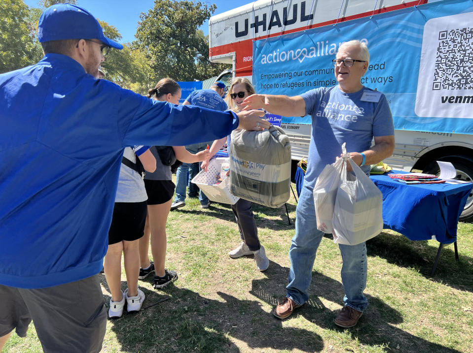 BYU fans donate pillows, sheets, blankets and more to help refugees in the Dallas-Fort Worth area when the football team played TCU on Oct. 14, 2023. | Tyler Stahle