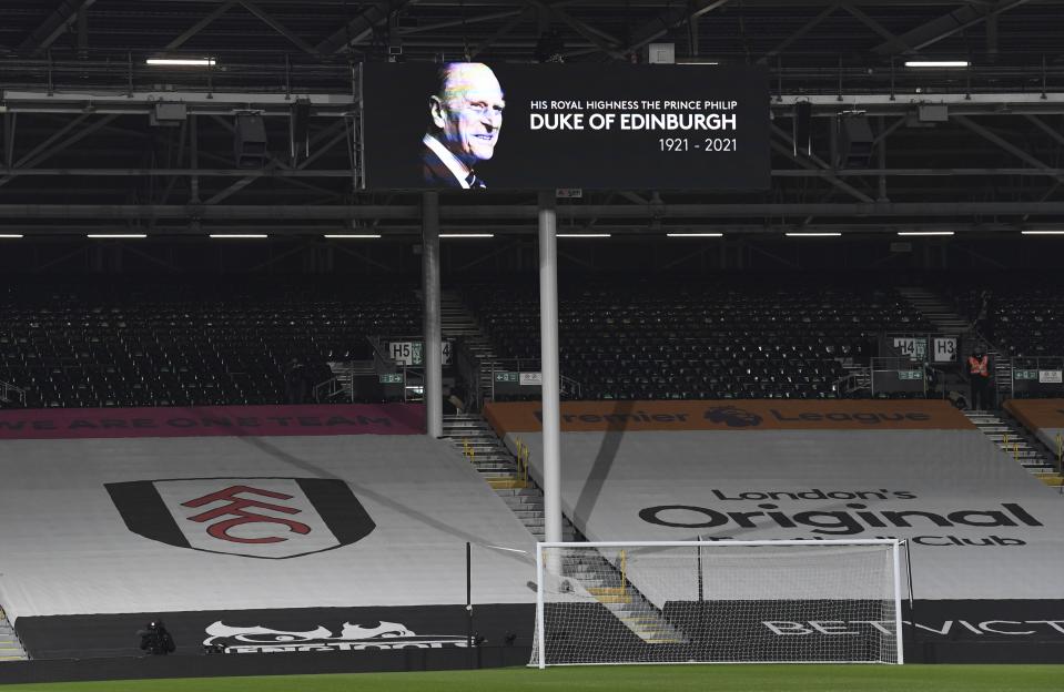 A tribute to Britain's Prince Philip, Duke of Edinburgh is featured on a billboard ahead of the English Premier League soccer match between Fulham and Wolverhampton Wanderers at Craven Cottage stadium in London, England, Friday, April 9, 2021.(Glyn Kirk/Pool via AP)