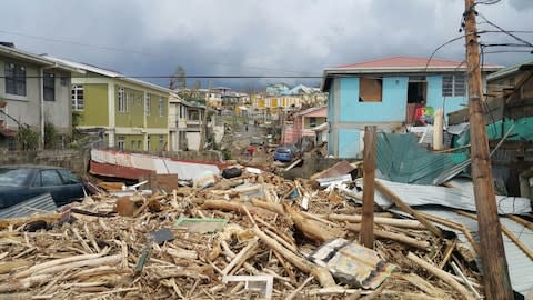 View of the damage caused the hurricanes in Roseau, Dominica this past September - Credit: Getty