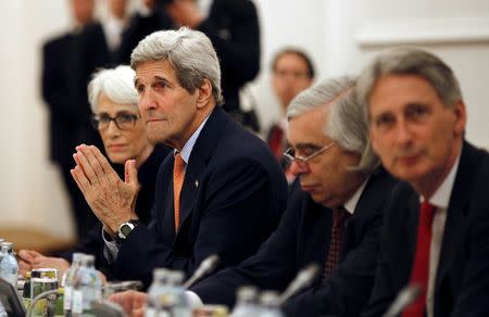 U.S. Secretary of State John Kerry meets with foreign ministers of Germany, France, China, Britain, Russia and the European Union during the Iran Talks meetings at a hotel in Vienna, Austria July 7, 2015. REUTERS/Carlos Barria