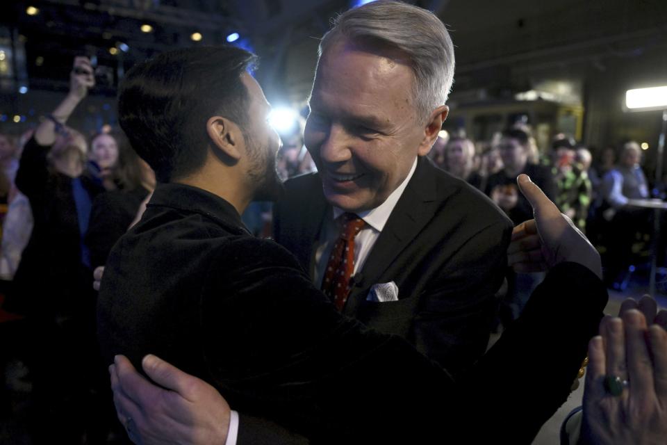 Social movement presidential candidate Pekka Haavisto, right, and his partner Antonio Flores celebrate at his election reception in Helsinki, Finland, Sunday, Jan. 28, 2024. Haavisto will head for second round run-off in Finnish presidential election. (Antti Aimo-Koivisto/Lehtikuva via AP)