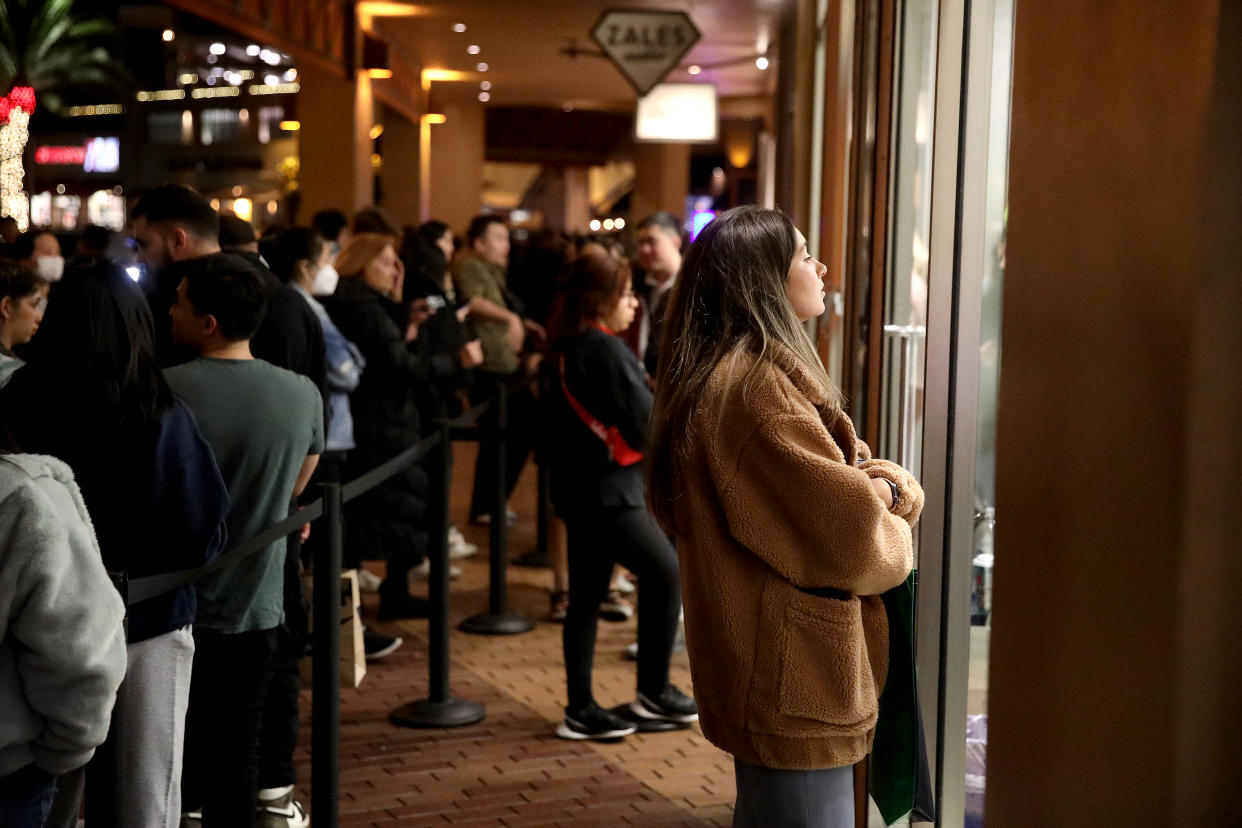 COMMERCE, CA - NOVEMBER 24: Angelica Rippee, 23, of Buena Park, along with other shoppers waits to get into the lululemon store to enjoy exclusive Black Friday deals on Thanksgiving night through the holiday weekend at the Citadel Outlets on Thursday, Nov. 24, 2022 in Commerce, CA. Citadel Outlets will open its doors to shoppers beginning at 8:00 p.m. on Thanksgiving for an all-night shopping party! Select stores will open their doors as early as noon, while most stores will open at 8:00 p.m. on Thanksgiving through 11:00 p.m. on Black Friday, staying open for over 27 hours straight. All stores will welcome shoppers at 6:00 a.m. on Black Friday and extended hours will continue through the weekend. (Gary Coronado / Los Angeles Times via Getty Images)