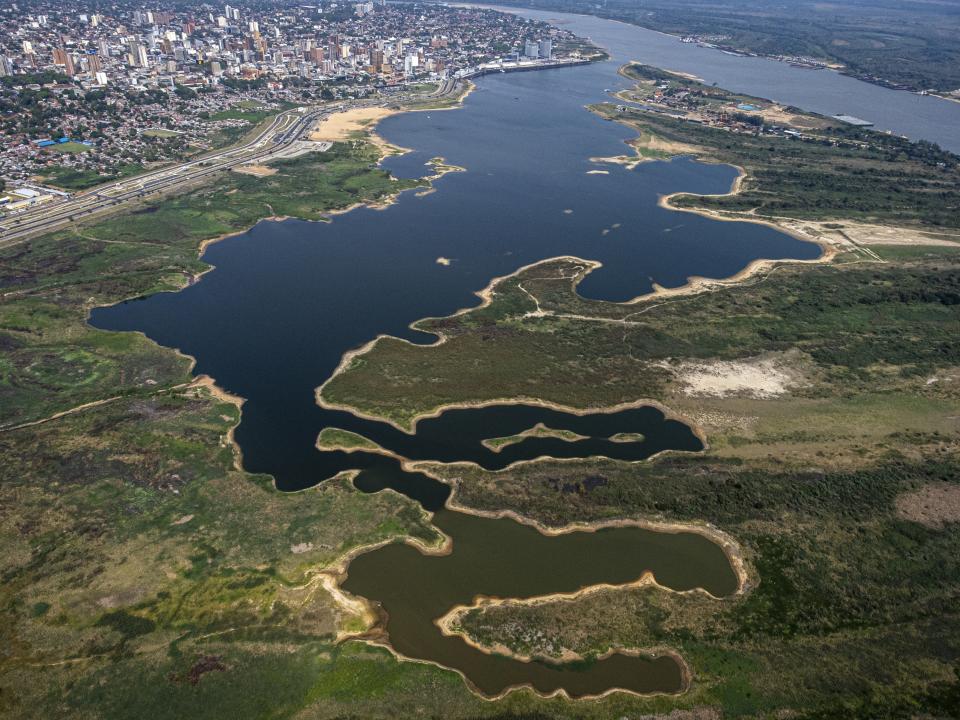 The banks of Asuncion Bay are exposed as the Paraguay River hits a historic low during a drought in Asuncion, Paraguay, Thursday, Sept. 23, 2021. (AP Photo/Jorge Saenz)
