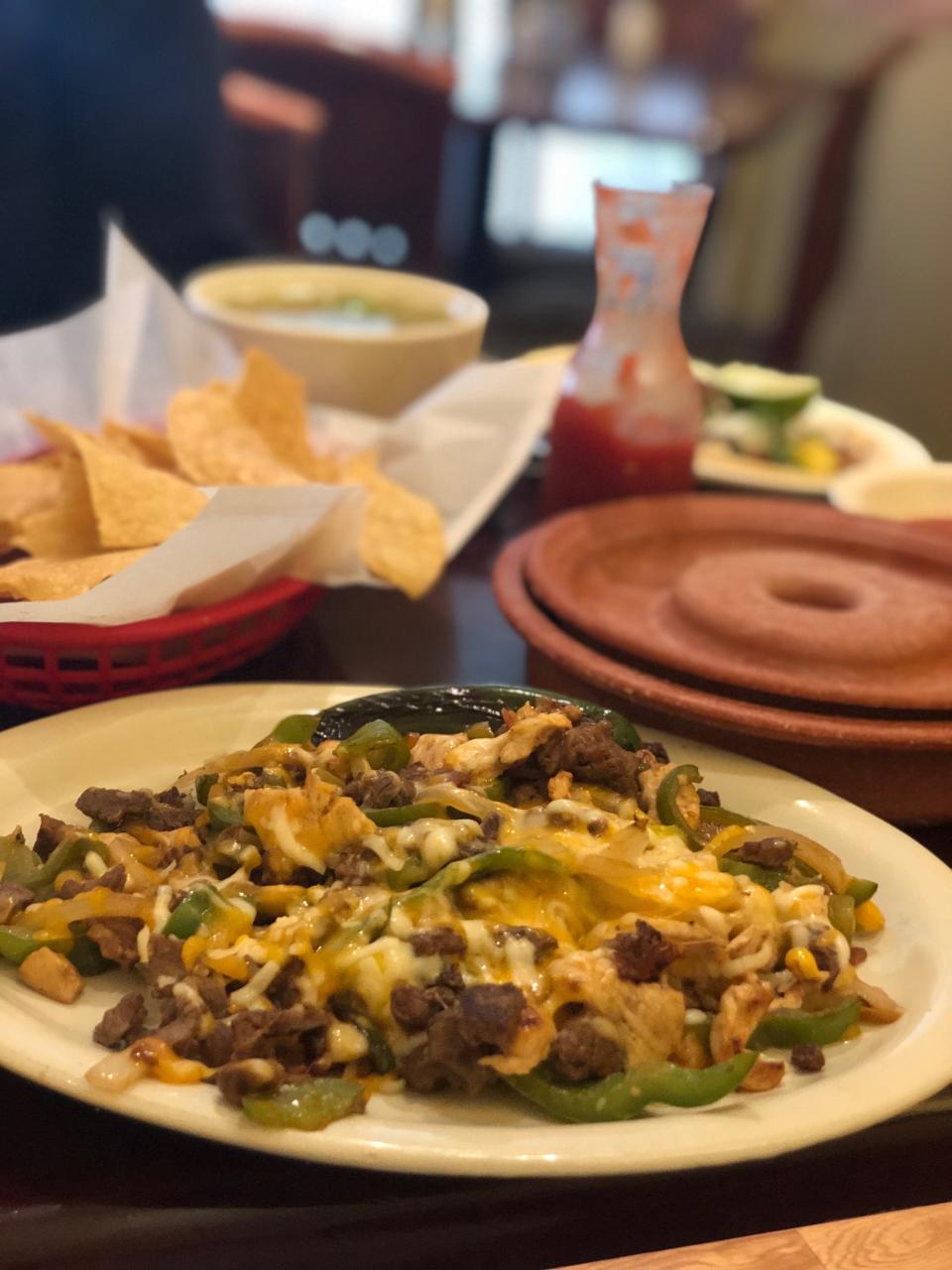 The steak and chicken fajitas at Las Delicias Mexican Bar & Grill.