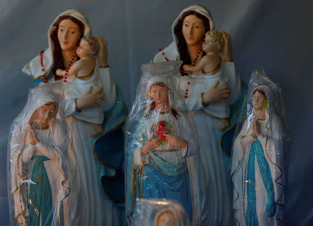 Statues of the Virgin Mary on sale at a stand near the shrine in Csatka, Hungary on September 9, 2017. REUTERS/Laszlo Balogh