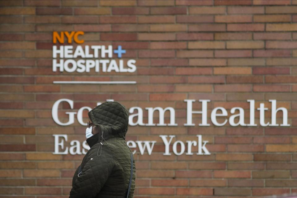 A woman arrives at Gotham Health East New York, a COVID-19 testing center Thursday, April 23, 2020, in the Brooklyn borough of New York. (AP Photo/Frank Franklin II)