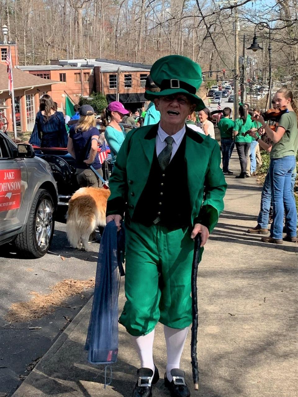 Ted Brunk is dressed as a leprechaun as he walks in the 2022 St. Patrick's Day Parade in Tryon.