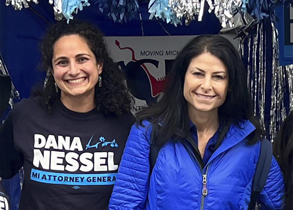 In this photo released by Kimberly Bush, Samantha Woll, left, poses with Michigan Attorney General Dana Nessel on Sept. 4, 2022, in Royal Oak, Mich. Woll, who worked on Nessel’s 2022 campaign, was found stabbed to death outside her home in Detroit on Saturday, Oct. 21, 2023. Woll was the president of the Isaac Agree Downtown Synagogue. (Kimberly Bush via AP)