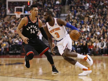 Nov 10, 2018; Toronto, Ontario, CAN; New York Knicks guard Tim Hardaway Jr. (3) tries to dribble around Toronto Raptors guard Danny Green (14) during the first half at Scotiabank Arena. John E. Sokolowski-USA TODAY Sports