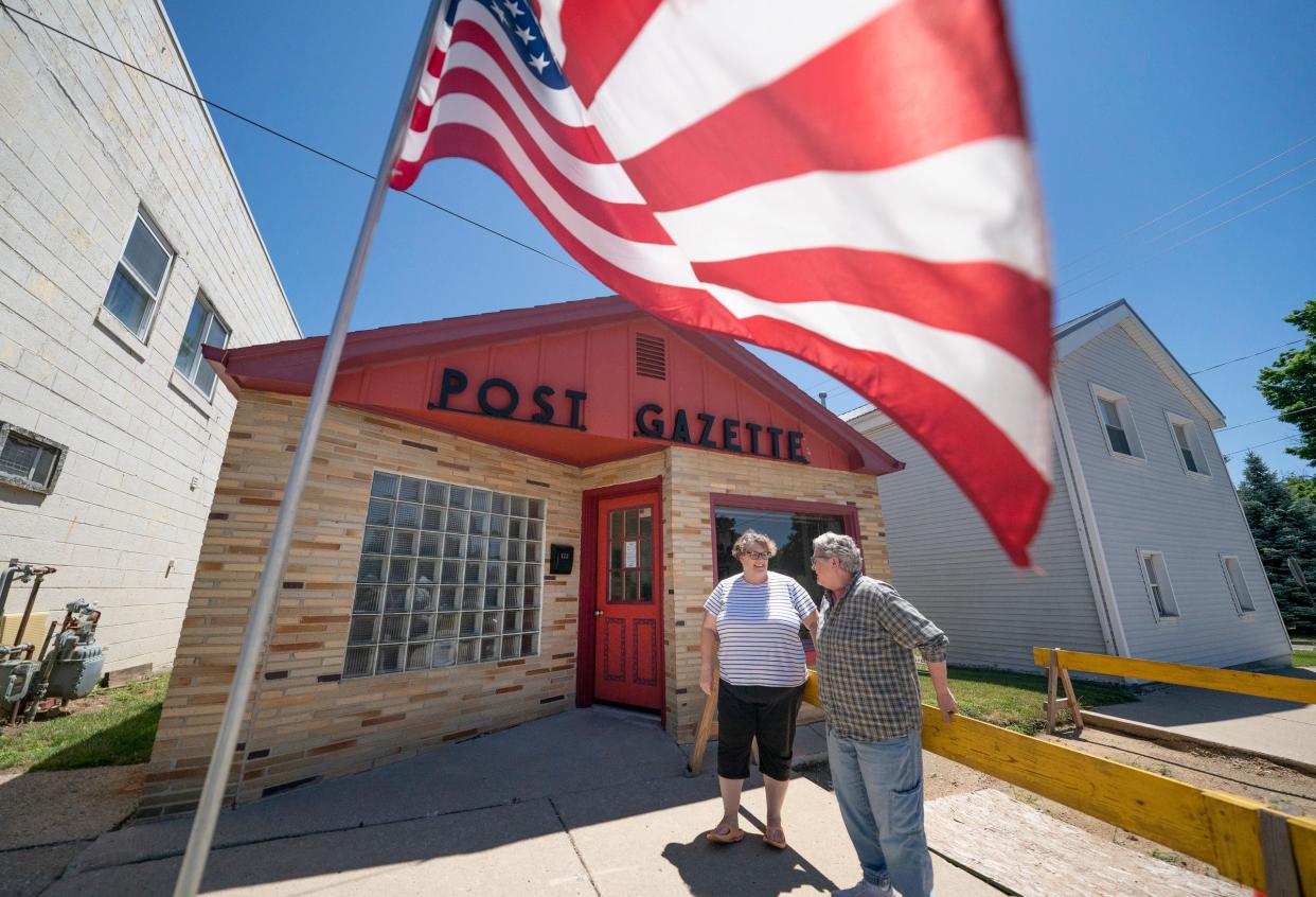 Rachel Stiverson, 53, of Hudson, left, stands with her aunt Barbara Ireland, 72, of Hudson on Monday, July 1, 2024 at the Hudson Post-Gazette. Ireland bought the paper in 2018 to keep it from closing after more than 160 years of publication even though she had no journalism experience whatsoever.