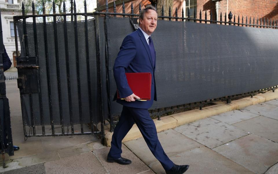 Lord Cameron, the Foreign Secretary, is pictured today arriving in Downing Street