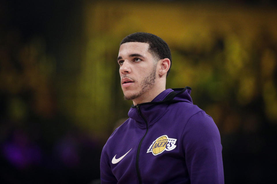 In this Dec. 21, 2018 photo, Los Angeles Lakers' Lonzo Ball warms up before an NBA basketball game against the New Orleans Pelicans in Los Angeles. Lonzo Ball and his company Big Baller Brand are suing co-founder Alan Foster, alleging he conspired to steal millions of dollars from the shoe and clothing line. The lawsuit filed Tuesday, April 2, 2019, in Los Angeles Superior Court says Foster concocted "a fraudulent scheme" to enrich himself with company money and also use it to buy property in Ethiopia. (AP Photo/Jae C. Hong)